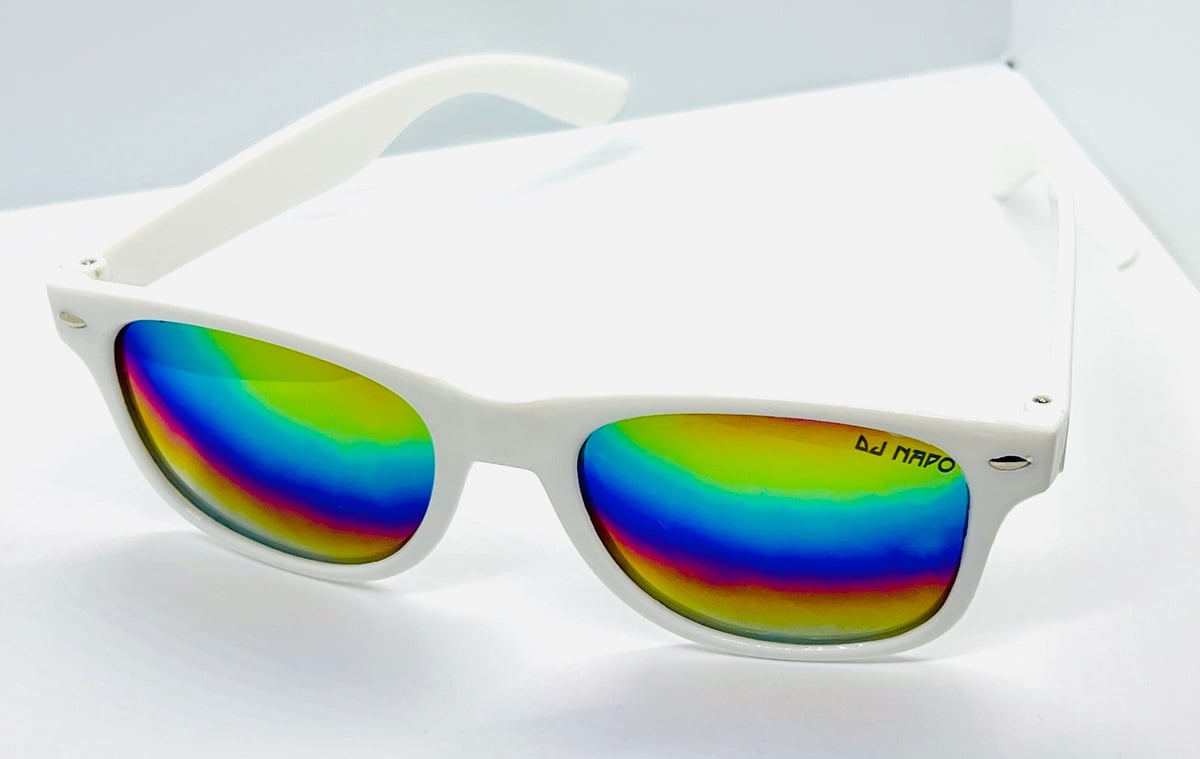 White framed sunglasses with rainbow gradient lenses against a light gray background