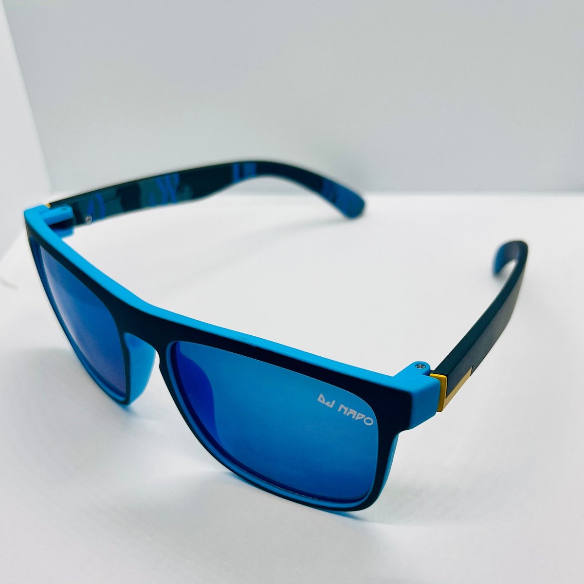 Pair of blue and black rectangular sunglasses with mirrored blue lenses on white background
