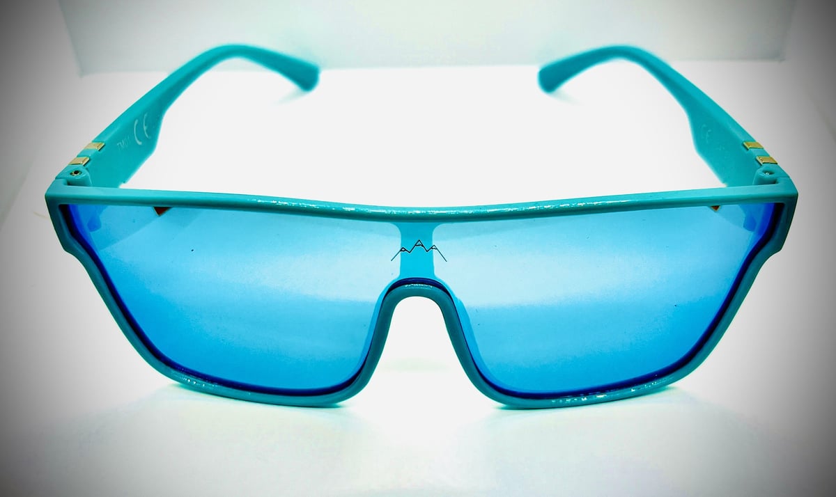 Pair of turquoise blue sunglasses with rectangular lenses and wide frame arms against a white background