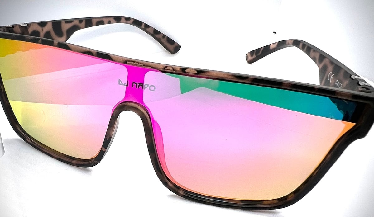 Pair of oversized sunglasses with tortoiseshell frames and gradient rainbow-tinted mirrored lenses