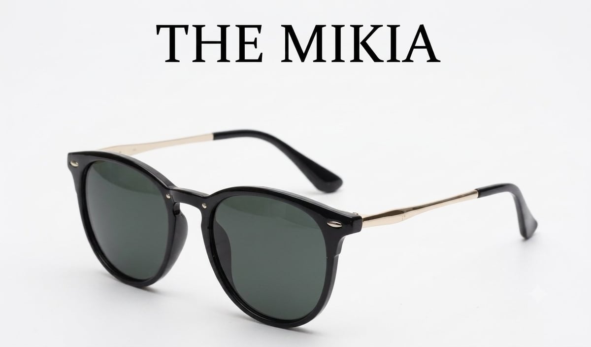 The Mikia black round sunglasses with dark green lenses and gold-toned metal temple arms displayed on a white background by TLA Promotions