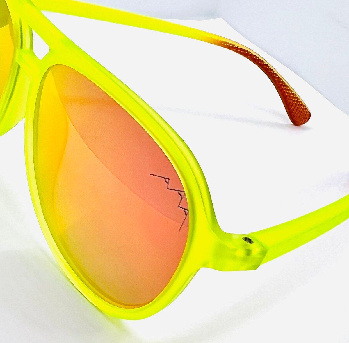 Bright High Flyer neon yellow sunglasses with orange gradient mirror lenses, the TLA mountain logo etched on the lens